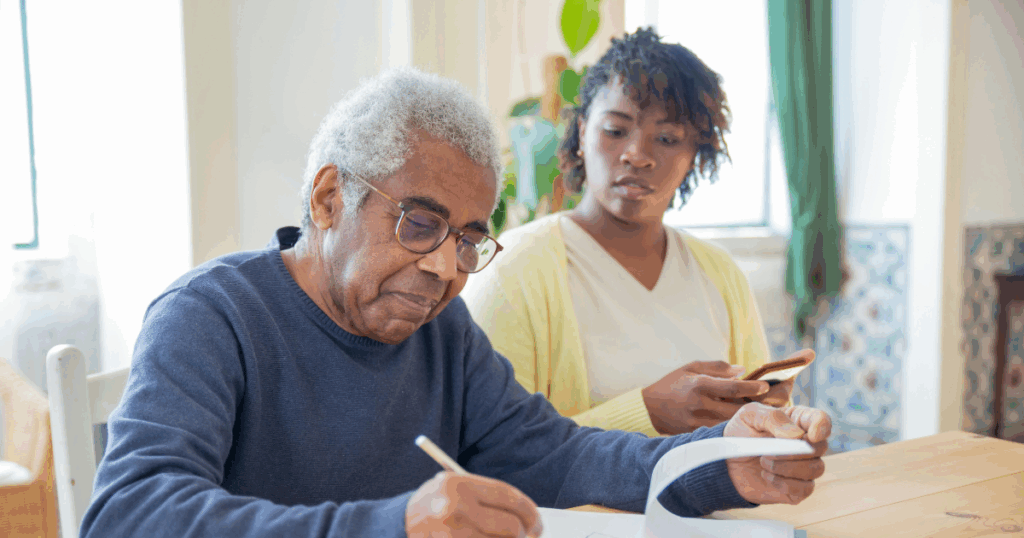 Dementia care: Man writing, woman with phone, supporting memory loss solutions and understanding dementia symptoms.