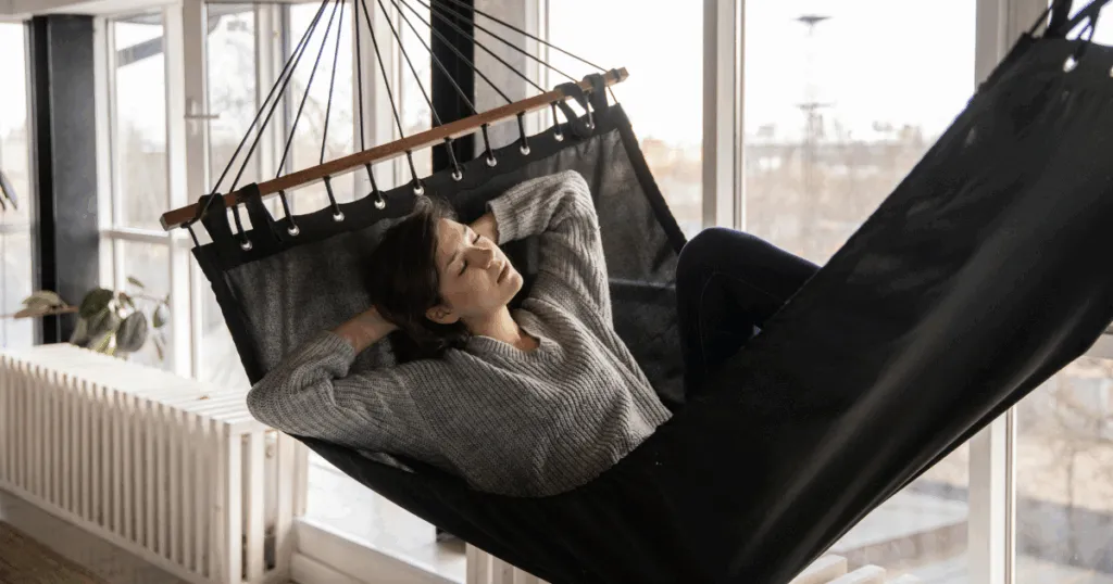 Woman relaxing in hammock, coping with Lexapro withdrawal. Peaceful scene for mental health and wellness support.