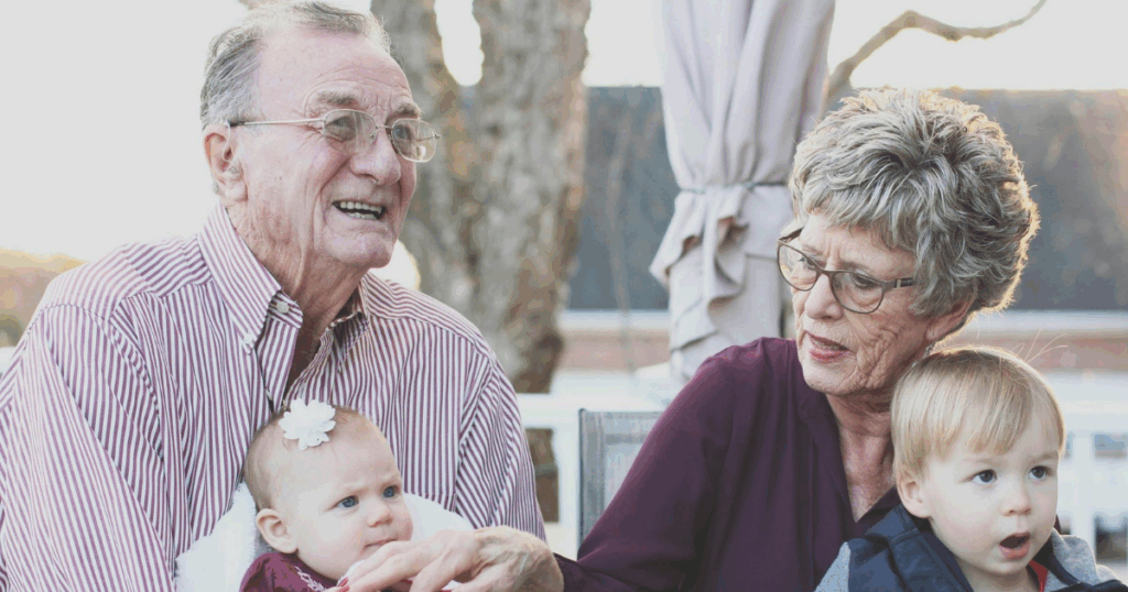 Grandparents with grandchildren. Image related to narcissism transformation, family relationships and positive change.